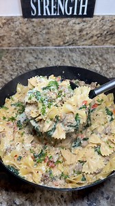 One Skillet Creamy Sausage Spinach Pasta Ingredients: • 2 tbsp olive oil • 1 white onion, diced • 4 garlic cloves, minced • 1 lb mild Italian sausage • 4 cups raw bow tie pasta • 1 can (about 14.5 oz) chicken broth • 2 cups heavy cream • 1 cup grape tomatoes, halved • 1 tbsp Kinder’s Buttery Garlic & Herb seasoning • ½ tbsp black pepper • 4 cups baby spinach • 4 cups sharp white cheddar cheese, shredded Instructions: 1. Heat olive oil in a large skillet over medium heat. 2. Add the diced onion a