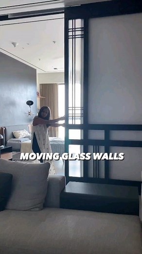 MOVING GLASS WALLS . Designed by @mtili_piques_red @devika_solkar @redrajiv @eeks25 Follow @spaceior_india for more . These large sliding walls allow flexibility to any space. It can transform a family TV room and integrate it with the rest of the living room or bedroom when needed. This 10ft by 10ft door made from solid wood and fluted glass offers a slight element of privacy while letting the natural light in, ensuring optimal space utilisation. . . . #flutedglass #wood #materials #slidingwall