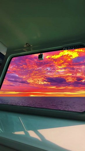Serene Ocean Sunset Views from a Moving Vessel