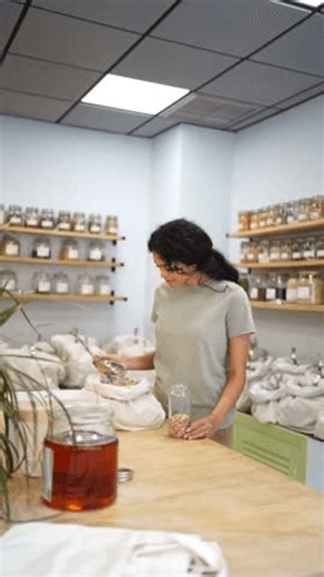 clip-3989611011-latina-woman-taking-chickpeas-organic-bulk-store