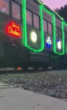 Southern Pacific SD9 #5472 leads the ‘Train Of Lights’ past bright side yard on the NCRR