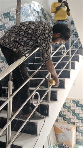 stainless steel railing installation with grinder red wheel