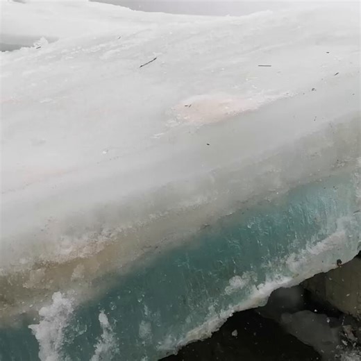 A dramatic ice shove in Tomsk, Siberia, where powerful winds and pressure force huge slabs of river ice onto the shoreline.