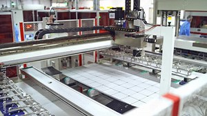 Footage of a working factory mechanism of solar cells distribution. Automated solar energy production. Contemporary factory for producing solar panels.