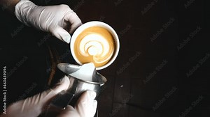footage of barista making late art in cafe. High quality 4k footage