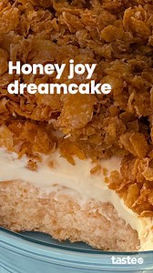 Who remembers Honey Joys? We’ve taken the crispy cornflake treat and turned it into a dreamy layer cake, with honey-soaked cake, fluffy vanilla mousse and that signature caramel crunch. And thanks to a packet cake mix and instant pudding mix, it's much easier to make than it looks! For the recipe, Google 'Taste Honey joy dreamcake'. Recipe by @stella_anna. #honeyjoys #cornflakecake #dreamcake #vanillamousse | Taste.com.au