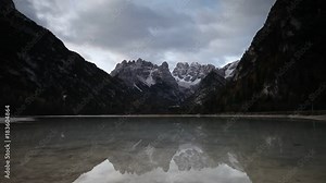 Italy. Lake Lago di Landro (Durrensee). Morning cloudy panoramic view. Time lapse