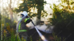 wildland firefighter working, wild fire close up authentic real video. forest service, environment, ecology. forest fire, wildfire, firemen extinguish fire, burning grass and bushes close up.
