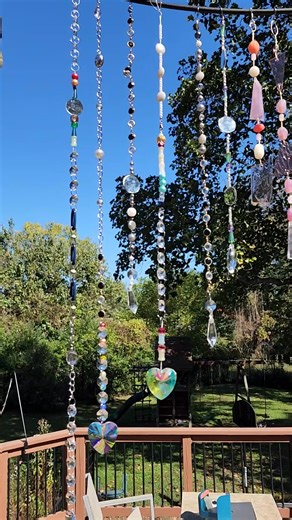 These sparkling strands of tree jewelry, or what I like to call my recycled jewelry suncatchers, glimmer in the sunlight and sway in the wind like nature’s own chandelier. https://www.myrepurposedlife.com/sparkling-diy-outdoor-suncatchers-from-old-jewelry-and-stained-glass/ | My Repurposed Life