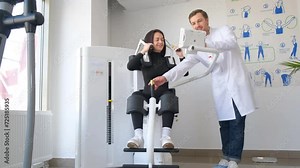 Female patient examining spine at physiotherapist at vertebrology center.