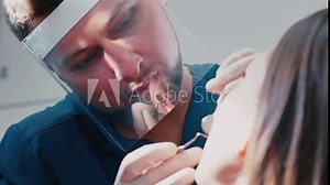 Woman having a check up at dentist's surgery. Dental office. Woman at the dentist clinic office gets dental medical examination and treatment.