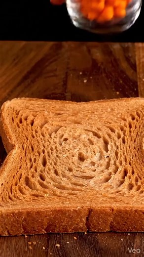 only_asmr. on Instagram: "Use headphones 🎧 for batter experience 🎧❤️📈 . . . . . . . . . Ultra-realistic macro food ASMR scene with strict visual-identity enforcement and locked composition.Define the object ONLY by name: (OBJECT).The Al must treat this object's real-world color, hue, tone, and surface identity as immutable and dominant at all times. Under no circumstances may the color shift toward butter, cream, yellow, beige, white, or dairy-like tones.A single thick slice of toasted bread