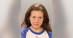 Police: Woman charged after spitting on 2 people in separate incidents