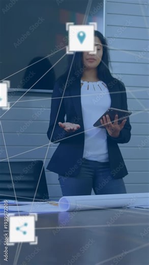 Vertical video: Tech presenter checking tablet and gesturing showing project network over plans
