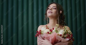 With colorful flowers and a charming model, this springtime advertising video captures the essence of floristry in a beautiful studio setting