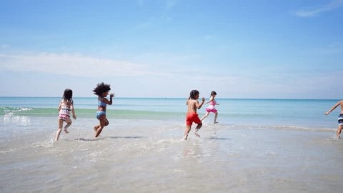clip-3680882443-happy-children-travel-playing-sea-on-summer