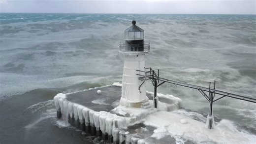 Waves Slam Frozen Michigan Lighthouse Amid Bitter Wind Chill