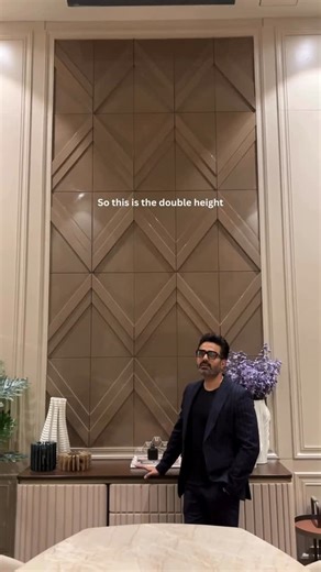 ESSENTIAL DESIGNS on Instagram: "Unveiling one of the most striking elements in our showroom — the perfect double-height panel. Join our Co-founder @tarunrajseth.essential as he walks you through the inspiration and craftsmanship behind this statement piece. From carefully selected materials to refined detailing, every layer is thoughtfully crafted to enhance scale, elegance, and presence. A true reflection of how bespoke design transforms a space. . . Essential Designs “Fine Living Spaces” Esse