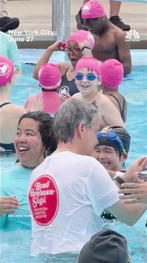 Mamdani jumps into a pool in his suit to mark opening of NYC pools