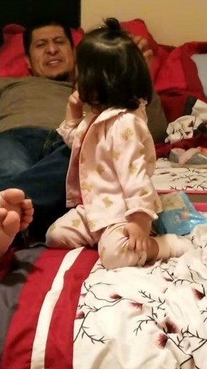 Jozzy biting dad's toes