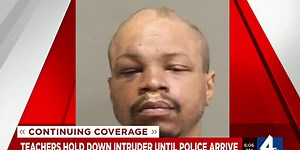 Teachers hold down intruder until police arrive