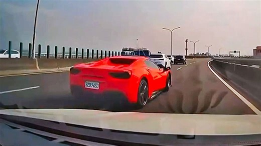 Ferrari crashes into barrier at speed on busy motorway in Taiwan