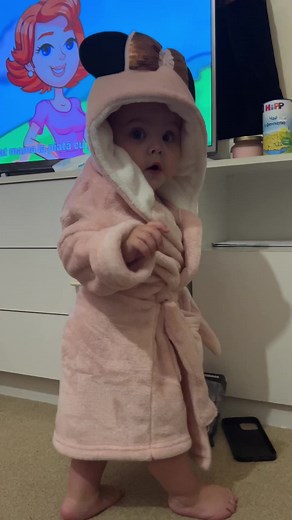Adorable Child in Minnie Mouse Bathrobe Playing