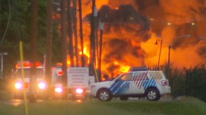 Flames erupt in deadly train derailment