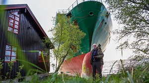 Cargo ship runs aground — and narrowly misses a Norwegian home