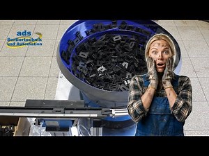 Zuführtechnik: Kunststoffclip - Wendelförderer für Vereinzelung