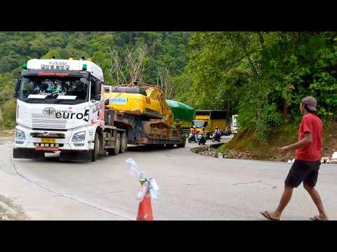 Heavy Equipment Transport: 3 FAW Trailer Trucks Carrying Excavators