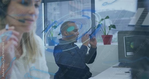 Man hearing audio cue, fitting headset as blue HUD intensifying, using chart, stretching in office