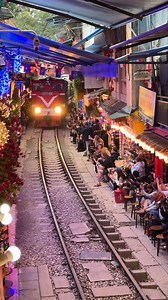 Hanoi’s iconic tight squeeze between cafés and a life railway! . . . Train street in Hanoi is narrow residential alley where a working railway line runs just inches local homes, cafés and daily life. Several times a day, the train passes through the tight space, creating a thrilling and unique scene as residents and visitors step back against the walls to let it pass. Located near the Old Quarter, it has become one of Hanoi’s most iconic and photogenic spots, offering a close-up look at the city