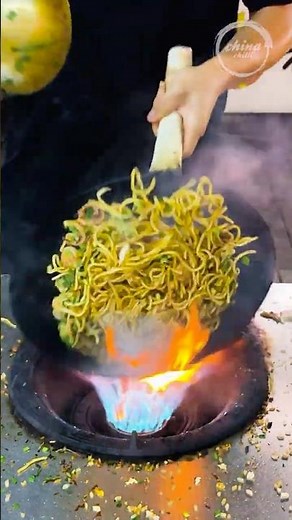 Chinese Street Food -Noodles dancing on flames, amazing wok cooking skills