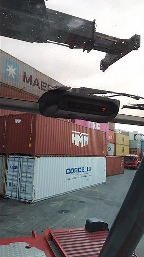 Kalmar Reach stacker with a tilting spreader for container handling