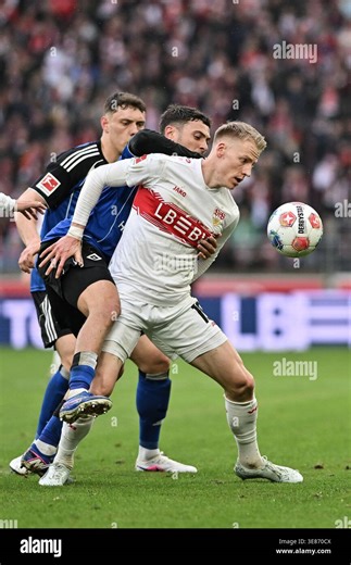 STUTTGART, GERMANY - 12. APRIL: tackle between Nicolai REMBERG (Hamburger SV 21), William MIKELBRENCIS (Hamburger SV 2) and Immanuel PHERAI (Hamburger SV 10) during the Bundesliga Match between VfB Stuttgart vs. Hamburger SV on Matchday 29 at MHP Arena / DFL REGULATIONS PROHIBIT ANY USE OF PHOTOGRAPHS AS IMAGE SEQUENCES AND/OR QUASI-VIDEO Stock Photo - Alamy