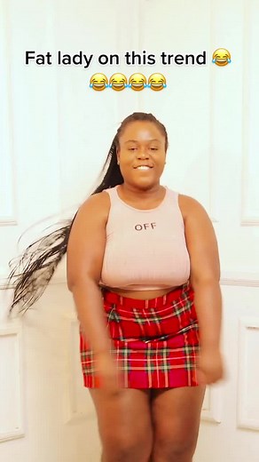 Dance Performance in Pink Sleeveless Top and Plaid Skirt