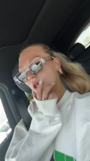 Blonde Individual Inside Vehicle With Black Interior