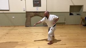 Kette gyakuzuki no tsukkomi is one of those techniques that I feel is often misunderstood. It’s best applied, not as a blow to the body, but as a downward strike to uke’s dropped head. The kick to the front of the pelvis disrupts their posture and causes their head to drop low and slightly to one side. The stance / bodyweight shift then ensures a strong downward punch to the head’s new position. As always, the hikite is active. Here it is ensuring a clear path for the punch. In the non-kicking v