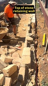 Sydney Sandstone, also known as Yellow Gold, Yellowblock and Hawkesbury Sandstone. It’s become very popular in Canberra due to its high availability and lower cost, due in part to the relatively short (for Australian standards) distance between the cities. With the huge colour variations it makes for stunning retaining walls. It’s actually a more cost effective option than our native stones Wee Jasper and Nimmitabel, which are both blue/grey, beautiful stone but much harder to work with. Which w