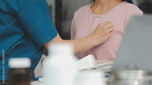 Gastroenterologist doctor explaining liver and gallbladder problems using anatomical model to patient during clinic visit. Treatment of gallbladder and liver diseases