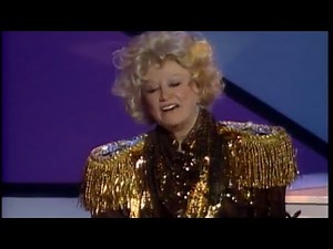 Phyllis Diller plays piano as Elton John