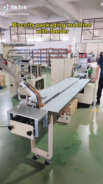 Practical flow packing machine #packingmachine #flowpack #biscuits #machinefactory #packaging WhatsApp me