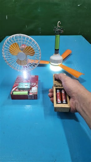 One ceiling fan and one table fan sharing the same remote control.