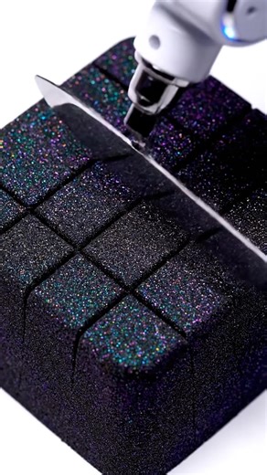 AI Robot Arm Cutting Kinetic Sand ASMR (Crunchy & Hissing Sounds) 😊 Experience the most precise ASMR cutting video you'll ever see. An AI-controlled robot arm slices through a block of iridescent black kinetic sand. This video is pure, oddly satisfying perfection, blending futuristic robotics with classic ASMR triggers. Listen to the incredible, high-fidelity crunchy, hissing, and cutting sounds as the blade glides through the sand. Perfect for relaxation, sleep, or anyone who loves tech and AS