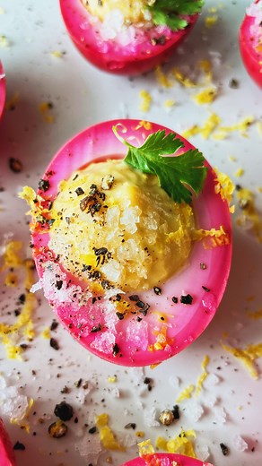 Carolina Gelen on Instagram: "PINK DEVILED EGGS - bright, vibrant pink eggs with a creamy spicy filling, you won’t be able to stop yourself from eating these Ingredients (4-6 servings) 8 to 10 eggs 2 cups leftover beet juice/brine from canned beets Filling 8-10 yolks Two large dollops of mayo, plus more as needed 1 to 2 teaspoons grated horseradish 1/2 teaspoon cayenne 1 garlic clove, minced Topping Salt Black pepper Citrus zest Herbs of choice Instructions 1. Bring a pot of water to a boil. Add