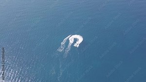 Stunning question mark symbol drawn on the blue sea by water scooter, 4k aerial