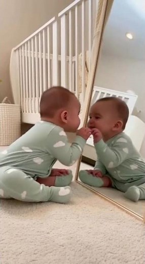 Baby's First Mirror Encounter: Adorable Reflection Discovery