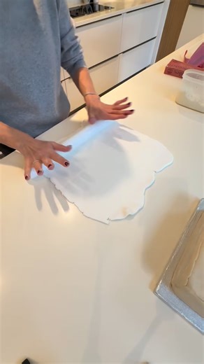 Sarah Hayes on Instagram: "✨ Christmas cake progress ✨ The Christmas cake is baked, fed and marzipaned… and now for stage two ~ icing! I’ve used ready-roll sugar paste, a cake smoother and good old hands-on patience to get a lovely smooth finish, ready for the Christmas roses, holly and ivy to be added. The board is iced too and finished with a velvet green ribbon for that final festive touch . Keep looking back for the final stage ✨ Would you like to learn how to ice your own cake with confiden