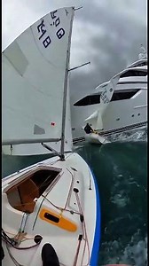 A luxury yacht cut across the dinghies like a bullet — sailors tacking everywhere to avoid disaster! 😳⛵ Caught on GoPro… this was way too close. 🌊🔥 | Love Sailing